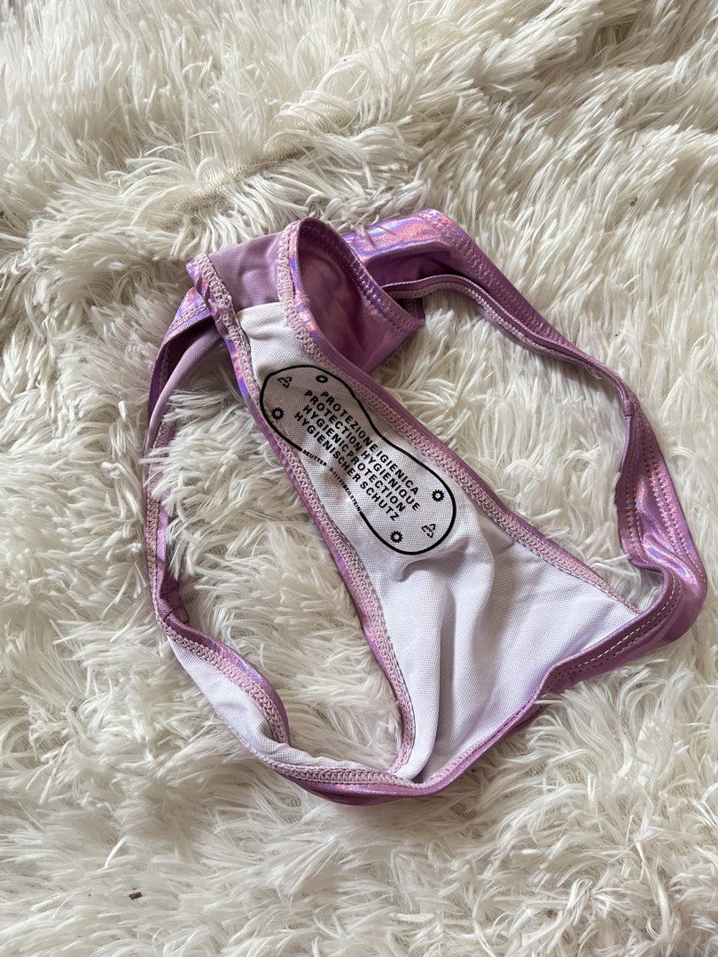 Metallic Holographic Purple Underwire Bikini Set Size S (Category: Bikinis & Swimsuits) located in Valenzuela. Submitted by lovepatt (Listing ID 1468787135, Image 2). Description: - Style: Purple holographic bikini set - Size: Small - Top: Underwire with adjustable straps and keyhole detail - Bottoms: Matching with white inner lining and hygiene sticker attached - Material: 82% polyester, 18% spandex - Origin: Made in China - Care: Wash dark colo