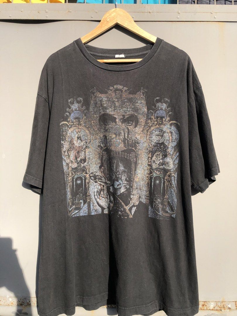 Michael Jackson Dangerous Tour Vintage Graphic Tee (Category: Tshirts & Polo Shirts ) located in San Jose. Submitted by mightycloud-7dc0 (Listing ID 1468804332, Image 1). Description: - Design: Large iconic Michael Jackson Dangerous album graphic on the front - Color/Wash: Black vintage-wash with a faded, authentic worn-in look - Details: Crew neck with a slightly distressed collar and short sleeves - Fit: Relaxed, comfortable fit - Sizing Note: 