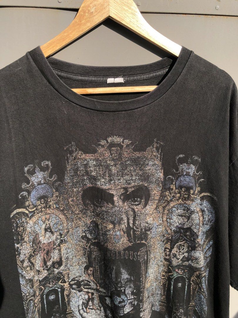 Michael Jackson Dangerous Tour Vintage Graphic Tee (Category: Tshirts & Polo Shirts ) located in San Jose. Submitted by mightycloud-7dc0 (Listing ID 1468804332, Image 2). Description: - Design: Large iconic Michael Jackson Dangerous album graphic on the front - Color/Wash: Black vintage-wash with a faded, authentic worn-in look - Details: Crew neck with a slightly distressed collar and short sleeves - Fit: Relaxed, comfortable fit - Sizing Note: 