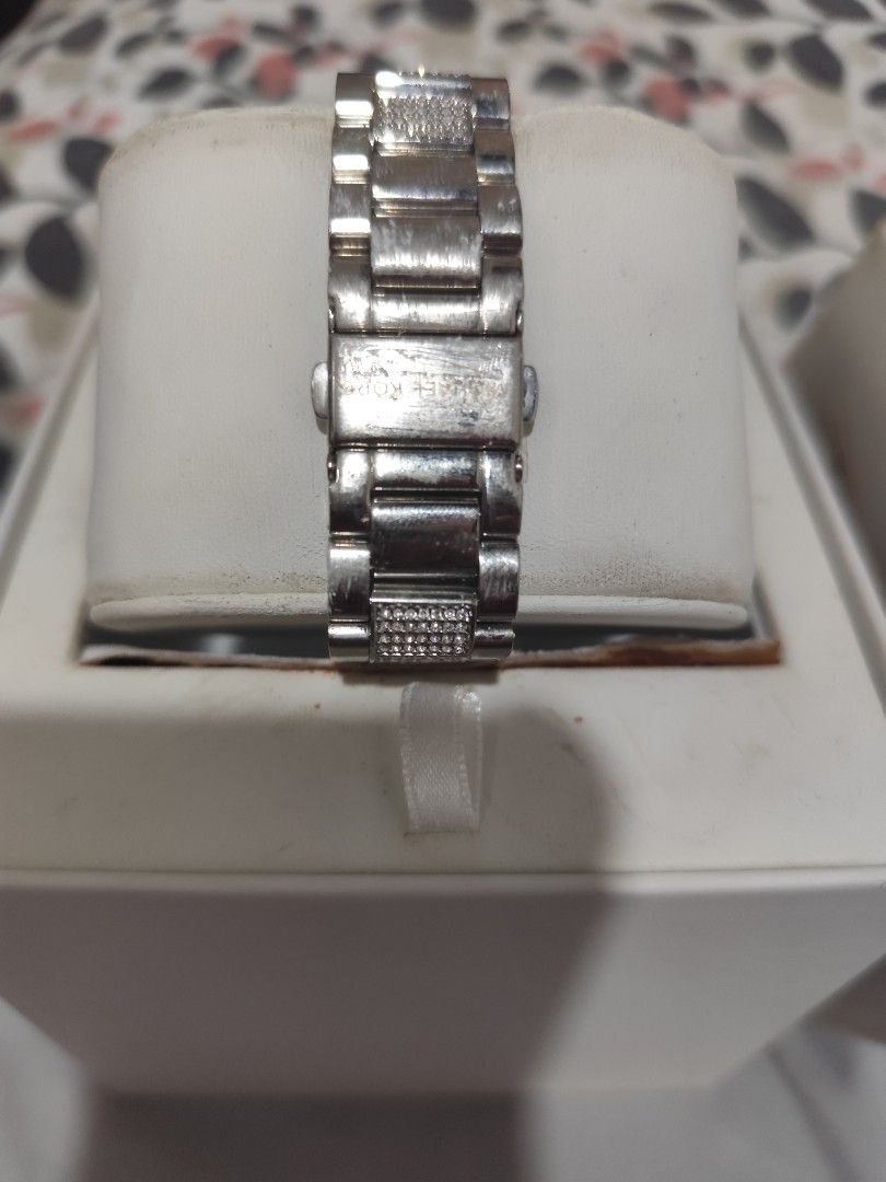 Michael Kors Access Silver Smartwatch with Pave Crystals (Category: Women's Watches) located in Manila. Submitted by marriage031073advocate (Listing ID 1468724940, Image 3). Description: - Brand: Michael Kors - Color/Finish: Silver-tone with clean metal finish - Display: Round digital display face - Details: Bracelet strap with embedded pavé crystals on center links and a single crown on the right - Inclusions: Original white presentation box and