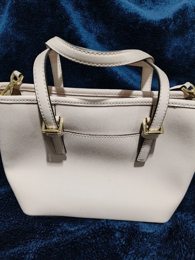 Michael Kors Bag for Sale (Category: Luxury Bags & Wallets) located in Makati City. Submitted by cecil.1 (Listing ID 1468823967, Image 3). Description: - Authentic Michael Kors tote in a chic powder blush Saffiano leather - Elegant gold-tone hardware with signature MK charm - Versatile carry: dual top handles + removable, adjustable crossbody strap - Secure zip top closure with a handy exterior back slip pocket - Structured, daily-sized carryall 
