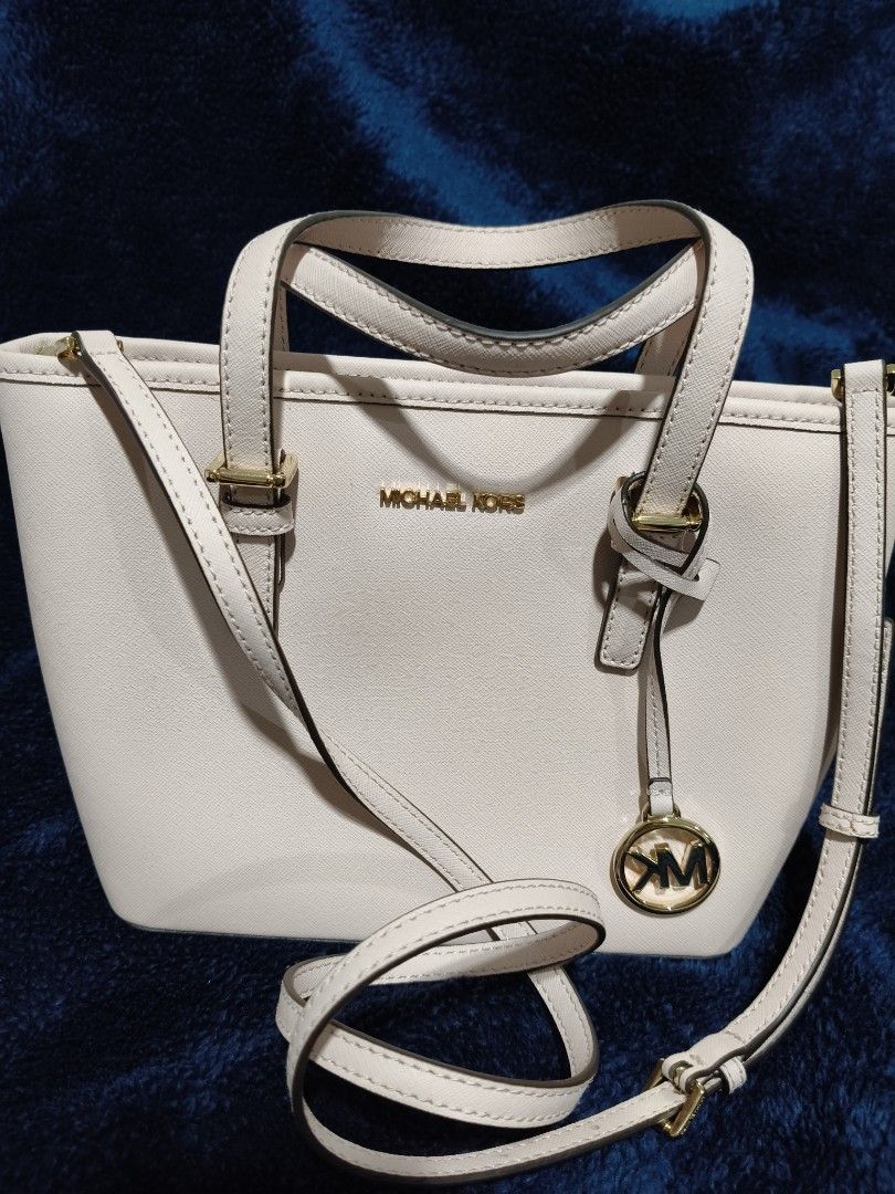 Michael Kors Bag for Sale (Category: Luxury Bags & Wallets) located in Makati City. Submitted by cecil.1 (Listing ID 1468823967, Image 2). Description: - Authentic Michael Kors tote in a chic powder blush Saffiano leather - Elegant gold-tone hardware with signature MK charm - Versatile carry: dual top handles + removable, adjustable crossbody strap - Secure zip top closure with a handy exterior back slip pocket - Structured, daily-sized carryall 