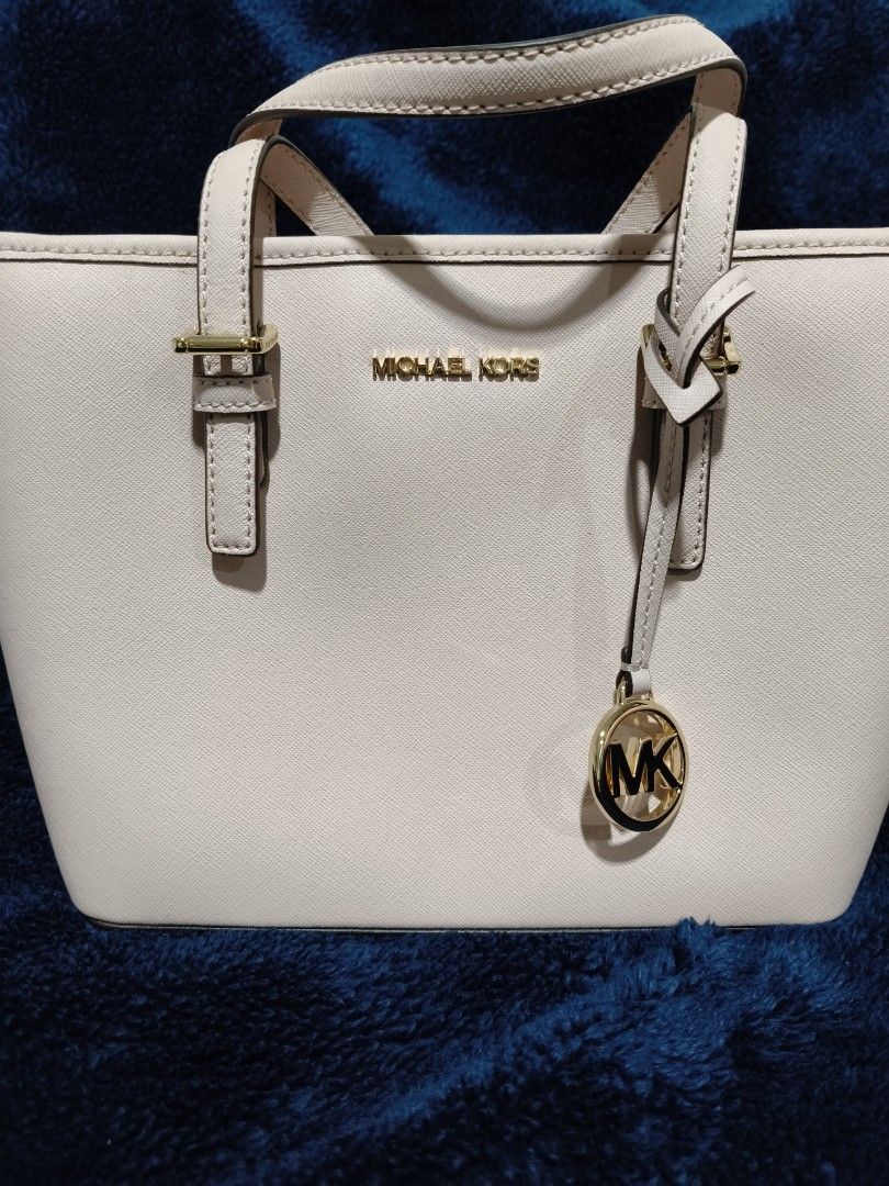 Michael Kors Bag for Sale (Category: Luxury Bags & Wallets) located in Makati City. Submitted by cecil.1 (Listing ID 1468823967, Image 1). Description: - Authentic Michael Kors tote in a chic powder blush Saffiano leather - Elegant gold-tone hardware with signature MK charm - Versatile carry: dual top handles + removable, adjustable crossbody strap - Secure zip top closure with a handy exterior back slip pocket - Structured, daily-sized carryall 