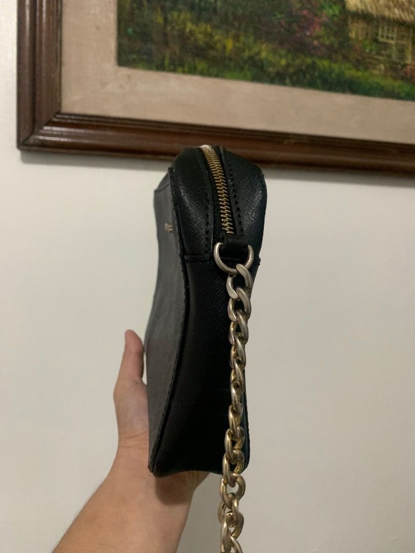 Michael Kors Black Crossbody Bag (Category: Cross-body Bags) located in Lapu Lapu. Submitted by goodfindsbyshee (Listing ID 1468925980, Image 3). Description: - Brand: Michael Kors - Material: Genuine black leather - Hardware: Premium gold-tone - Closure: Secure zip-top - Strap: Elegant chain accent - Interior: Fabric-lined with 1 slip pocket - Shape: Trendy and structured camera bag - Condition: Excellent, clean inside and out.