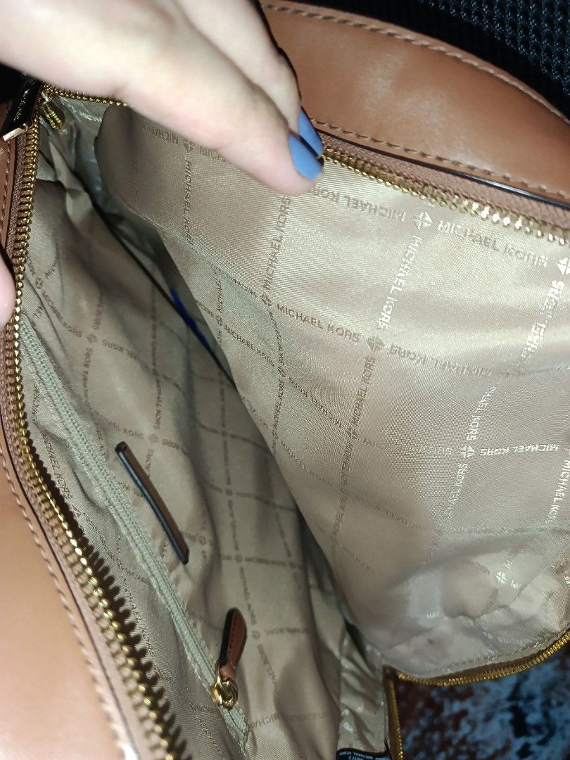 Michael Kors Brown Monogram Leather Backpack (Category: Backpacks) located in Manila. Submitted by dhen15 (Listing ID 1468863644, Image 3). Description: Authentic Michael Kors brown monogram backpack with tan leather trim and gold hardware. Comes with original care cards. Perfect for everyday use! Mop/Shipping available. Large Size and sobrang linis Declutter.