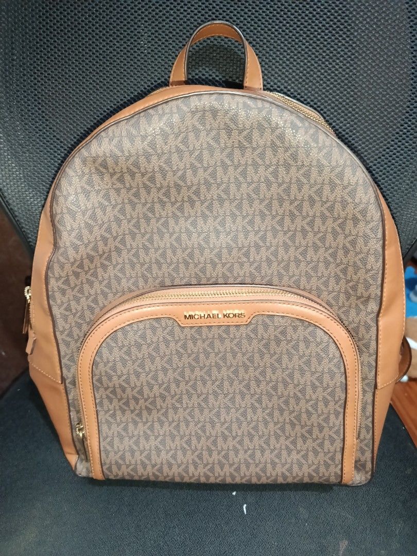 Michael Kors Brown Monogram Leather Backpack (Category: Backpacks) located in Manila. Submitted by dhen15 (Listing ID 1468863644, Image 1). Description: Authentic Michael Kors brown monogram backpack with tan leather trim and gold hardware. Comes with original care cards. Perfect for everyday use! Mop/Shipping available. Large Size and sobrang linis Declutter.