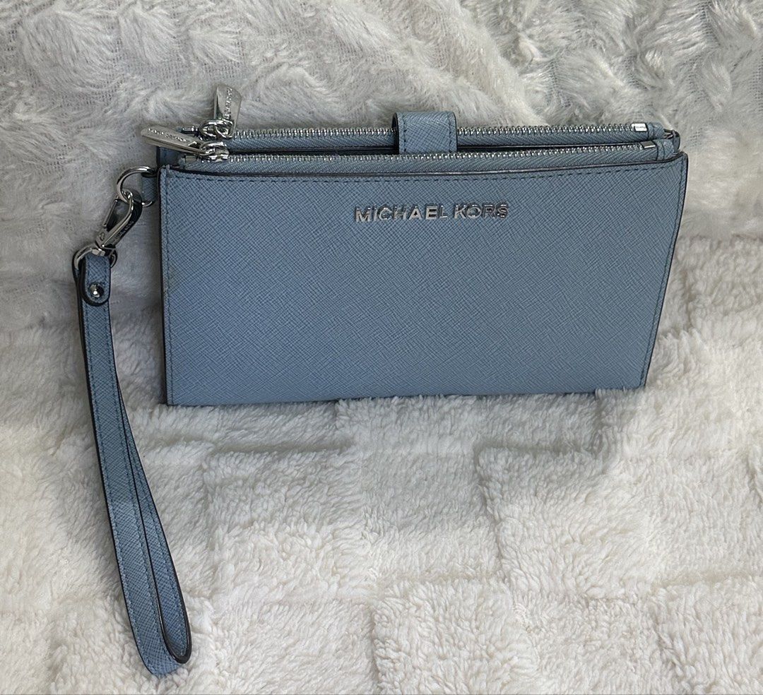 Michael Kors Jet Set Wristlet Wallet Large (Category: Wallets & Card holders) located in Santa Rosa. Submitted by esplanamur03635 (Listing ID 1468775152, Image 3). Description: - Authentic Michael Kors wallet - Material: Premium powder blue -Saffiano leather - Hardware: Silver-tone with clear front logo lettering - dual Zip-around top and 2 snap-button main and inner - Matching detachable wrist -strap - Clean exterior, clean interior multiple com
