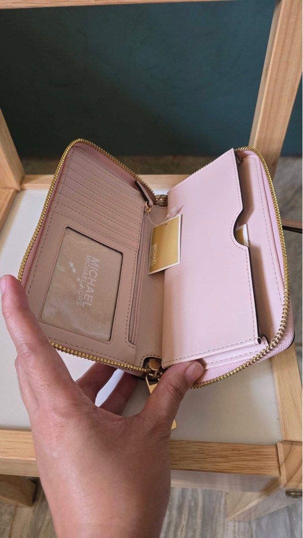 Michael Kors phone wallet in blush (Category: Wallets & Card holders) located in Mandaluyong City. Submitted by camrypgo (Listing ID 1468806904, Image 2). Description: Brandnew MK phone wallet. Can fit promax and samsung ultra phones. Color is blush. Super nice in actual. Rfs: spare wallet. .