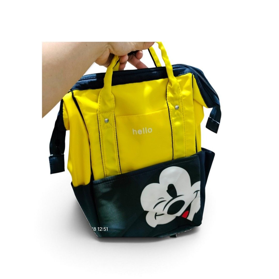 Mickey Mouse Diaper Bag Backpack (Category: Backpacks) located in Caloocan City. Submitted by almaeternamara (Listing ID 1468924426, Image 1). Description: Layout & Compartment Breakdown Main Pocket: Wide, doctor-bag style rectangular top opening with an internal frame for easy visibility and packing. Front Pouch: Zippered compartment embedded with thermal-insulated bottle holders to maintain liquid temperatures Exterior Sides: Dual open pockets 