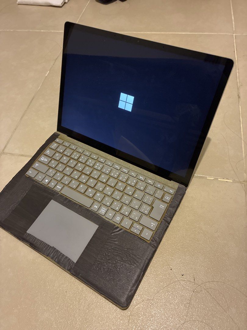Microsoft Surface Laptop Japanese Keyboard (Category: Laptops & Notebooks) located in Las Pinas. Submitted by mrcolorless (Listing ID 1468861956, Image 3). Description: - Microsoft Surface Laptop (Silver Aluminum finish) - Japanese layout keyboard - Screen turns on normally, displays Windows logo - Perfect for daily tasks, typing, and web browsing - Note: Has a sticker on the lid and black tape applied around the palm rest area - Trackpad no long
