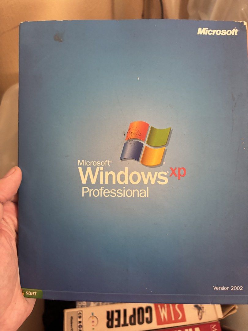 Microsoft Windows XP Professional Version 2002 CD and Box (Category: Software) located in Iloilo. Submitted by TheKinfolkGarage (Listing ID 1468870152, Image 1). Description: - Authentic Microsoft Windows XP Professional software (Version 2002) - Includes original blue outer box, installation CD, and instruction manuals - Perfect for retro tech collectors and vintage PC builds - Condition: As shown in photos - Message for inquiries or shipping de