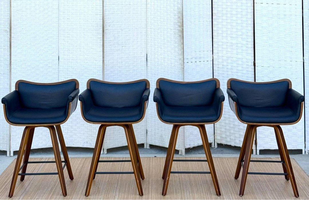 Mid-century modern wooden bar stools (Category: Chairs) located in Manila. Submitted by justinlei.103 (Listing ID 1468835892, Image 1). Description: JAPAN SURPLUS SWIVEL BLACK LEATHER BAR CHAIR WOODEN FRAME IN GOOD CONDITION SIZE: 23H x 21.5L x 17W inches.