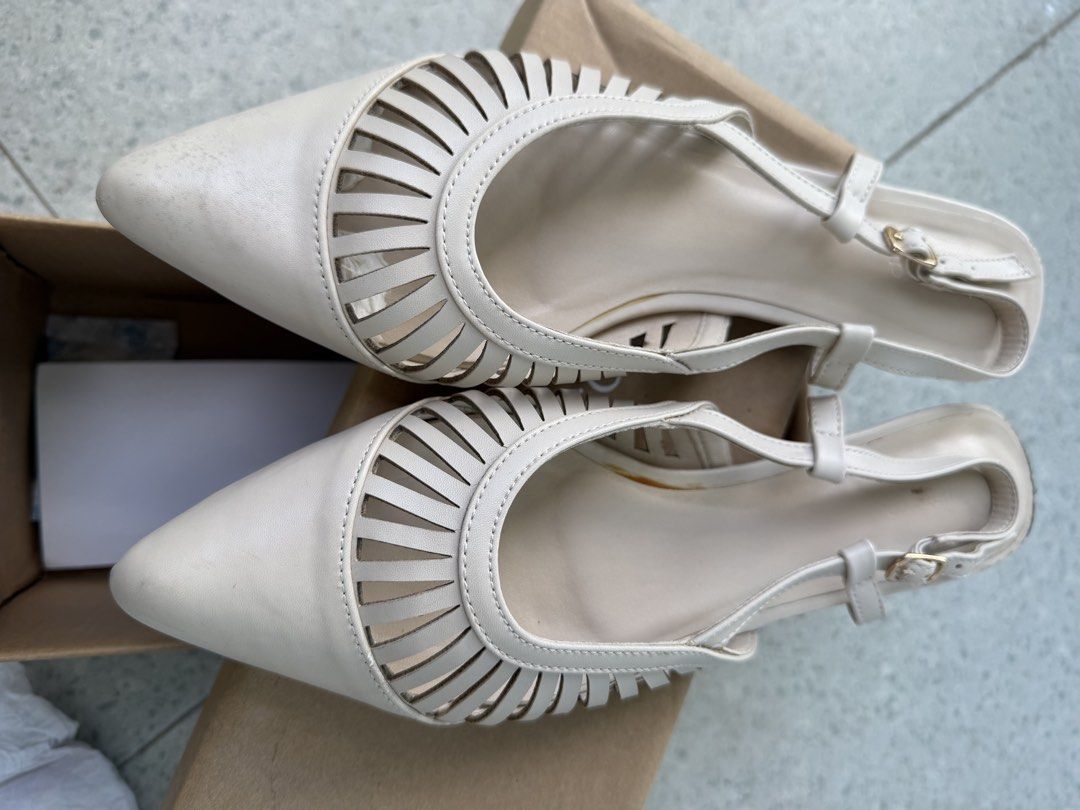 Milliot & Co. Pointed Toe Cut-Out Slingback Heels Size 40 (Category: Heels) located in San Antonio. Submitted by luvstuffffff (Listing ID 1468726407, Image 3). Description: - Brand: Milliot & Co. - Style: Beige slingback heels with pointed toe - Features: Cut-out strap details across the front, comfortable low block heel - Closure: Adjustable ankle strap with buckle - Size: 40 (marked on sole) - Inclusion: Comes with original box - Condition: Exc
