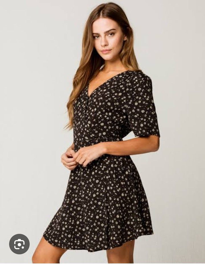 Mini floral dress (Category: Dresses) located in Manila. Submitted by wheneity67thifted (Listing ID 1468927100, Image 1). Description: This is a black short-sleeve mini dress with a ditsy white floral print, V-neckline, and a ruffled front detail..