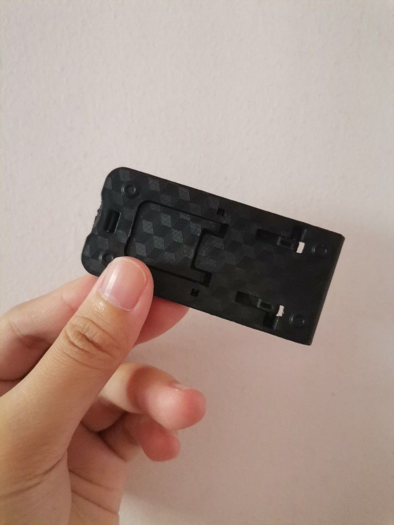 Mini foldable phone stand (Category: Mounts & Holders) located in Makati City. Submitted by kookybearsstuff (Listing ID 1468772954, Image 3). Description: - Color: Black - Type: Mini foldable phone stand - Condition: Good, compact, and portable design - Features: Easily folds flat for travel and daily commute - Meetup Locations: Glorietta Mall or Circuit Makati - can do same day delivery or J&T.