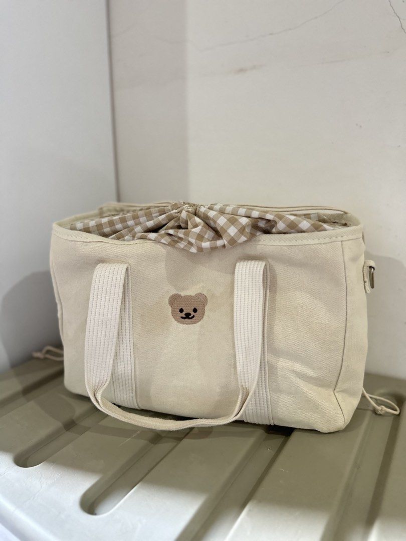 Minimalist Bear Canvas Baby Bag (Category: Tote Bags) located in Kalibo. Submitted by xoxo.kaebb (Listing ID 1468768541, Image 1). Description: Spacious/ large capacity baby bag with drawstring closure. RFS: Decluttering.