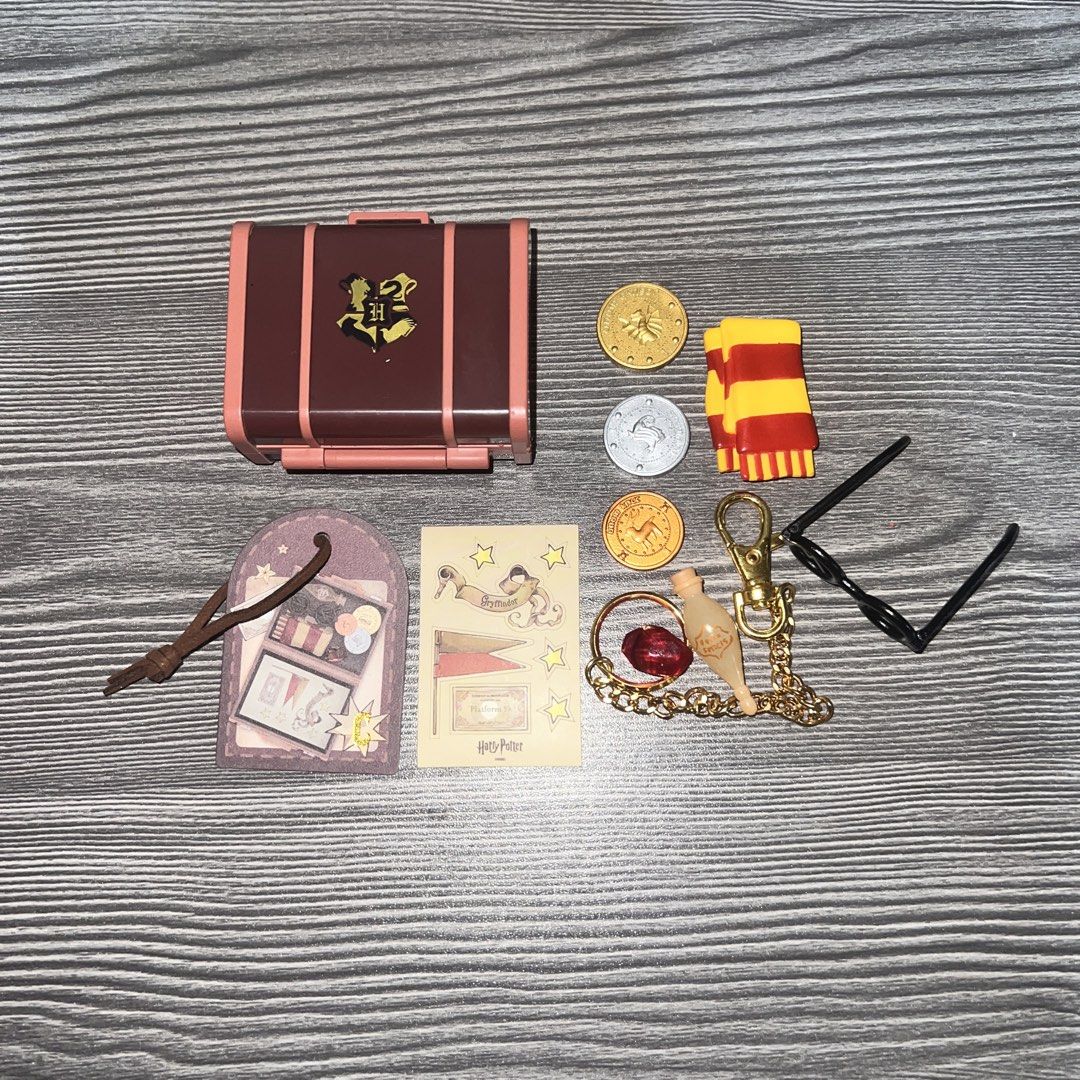 Miniso Harry Potter Suitcase Blind Box (Category: Designer & Blind Box Toys) located in Antipolo. Submitted by kathmerx (Listing ID 1468881108, Image 2). Description: WTS LFB PH Miniso Harry Potter Suitcase Blind Box - Official Miniso Harry Potter box pendant collectible set - Unboxed only to check contents; complete items; BIB - Includes miniature suitcase trunk, Gryffindor scarf, and iconic round glasses - Comes with gold and silver coins, poti