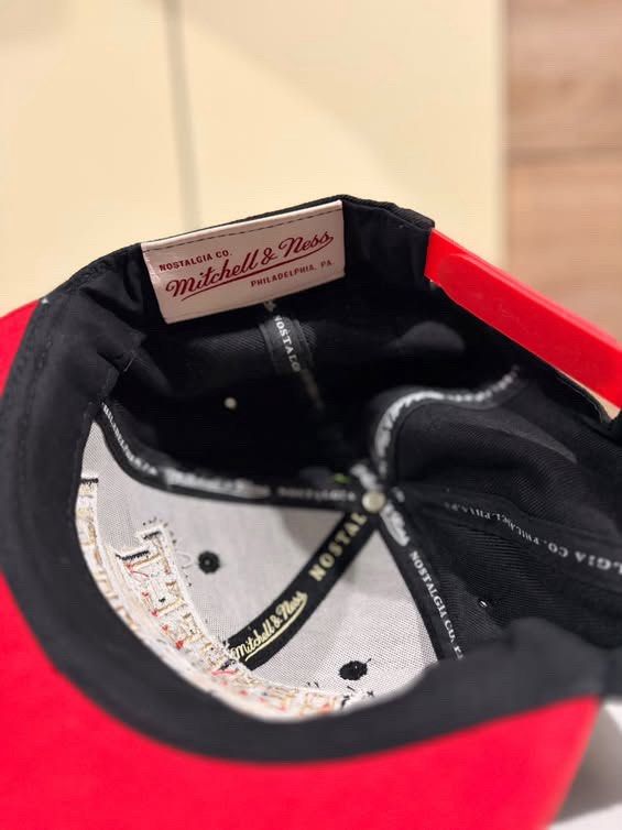 Mitchell & Ness Respect The North Snapback Cap (Category: Vintage Collectibles) located in Cebu City. Submitted by ubecstoned (Listing ID 1468825266, Image 3). Description: - Brand: Mitchell & Ness - Style: Snapback hat with flat brim - Colors: Black crown, red flat brim, and neon green piping - Embroidery: "Respect The North" in gold and white with red outlines on the front - Closure: Adjustable snapback - Authenticity: Official branding tag sti