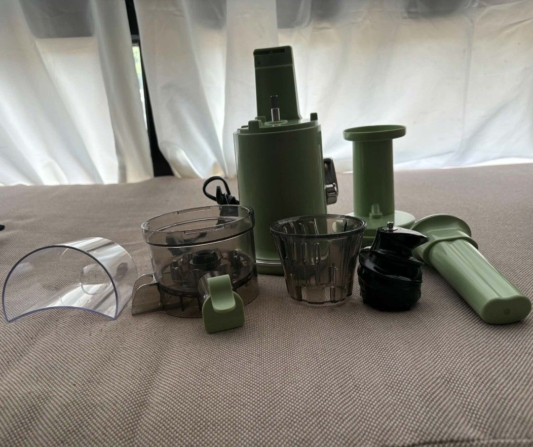 MIUI Mini Slow Juicer SPL-1702E (Category: Juicers, Blenders & Grinders) located in Marikina City. Submitted by wildmoon7459 (Listing ID 1468925158, Image 1). Description: - Brand: MIUI Slow Masticating Juicer - Color: Aesthetic Sage Green - Design: Space-saving vertical footprint, easy to assemble and clean - Inclusions: Motorized base, auger, juicing bowl, filter basket, pusher, and juice cup (complete parts shown in photos) - Power: Standard p