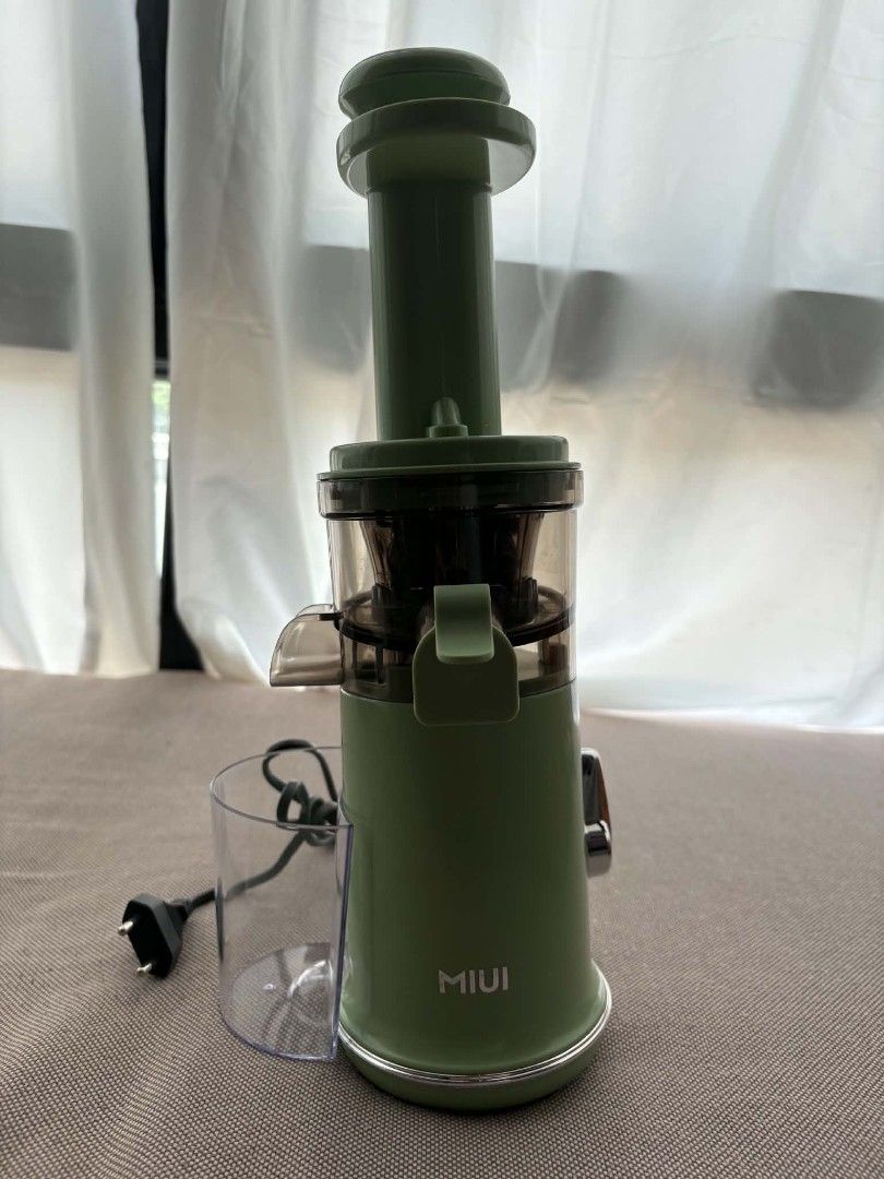 MIUI Mini Slow Juicer SPL-1702E (Category: Juicers, Blenders & Grinders) located in Marikina City. Submitted by wildmoon7459 (Listing ID 1468925158, Image 2). Description: - Brand: MIUI Slow Masticating Juicer - Color: Aesthetic Sage Green - Design: Space-saving vertical footprint, easy to assemble and clean - Inclusions: Motorized base, auger, juicing bowl, filter basket, pusher, and juice cup (complete parts shown in photos) - Power: Standard p