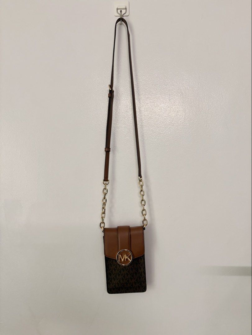 MK Phone Crossbody Bag (Category: Cross-body Bags) located in Pasay City. Submitted by weartheclothes.mnl_shop (Listing ID 1468738770, Image 1). Description: MK Carmen Phone Crossbody Bag Almost New Used twice .