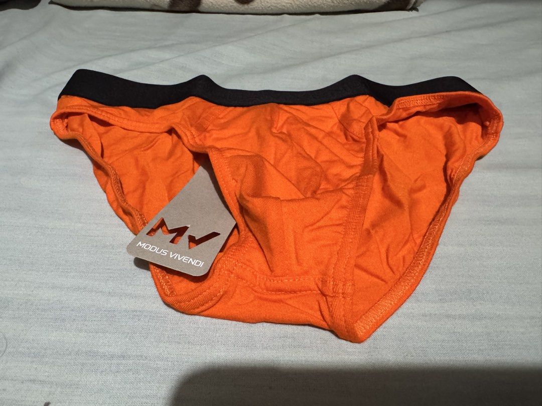 Modus Vivendi Orange Briefs (Category: Underwear) located in Caloocan City. Submitted by rodelramos.rivera (Listing ID 1468929052, Image 1). Description: - Brand: Modus Vivendi - Style: Bright orange briefs with subtle black elastic waistband - Size: One (Article MV-GIFT) - Condition: Brand new, unworn, and still sealed in original zip bag - Inclusions: Comes with original tag and packaging pouch.