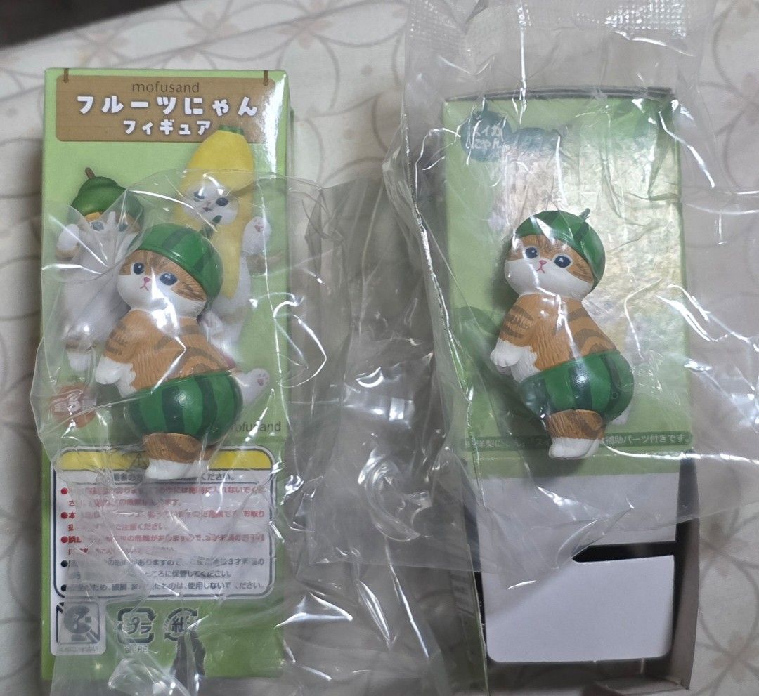 Mofusand Fruit Cat Figurine Watermelon Design (Category: Designer & Blind Box Toys) located in Agdangan. Submitted by toniebuys (Listing ID 1468819425, Image 1). Description: Authentic Mofusand fruit figurine [Watermelon] for 250ea Brand new, opened bottom box to check but sealed in original plastic.