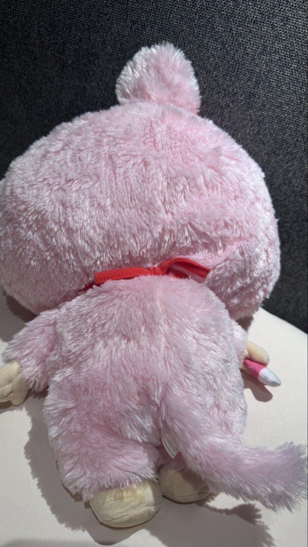Monchhichi Pink Plush Doll with Pacifier and Bib (Category: Plushies & Soft Toys) located in Mandaluyong City. Submitted by maelovestoshop (Listing ID 1468882701, Image 3). Description: - Authentic pink Monchhichi plush doll by Sekiguchi - Super soft furry texture with a cute face, freckles, and sticking-out tongue - Wears a classic red bib with white trim and a matching red hair bow - Holds a detachable pink pacifier in its right hand - Official