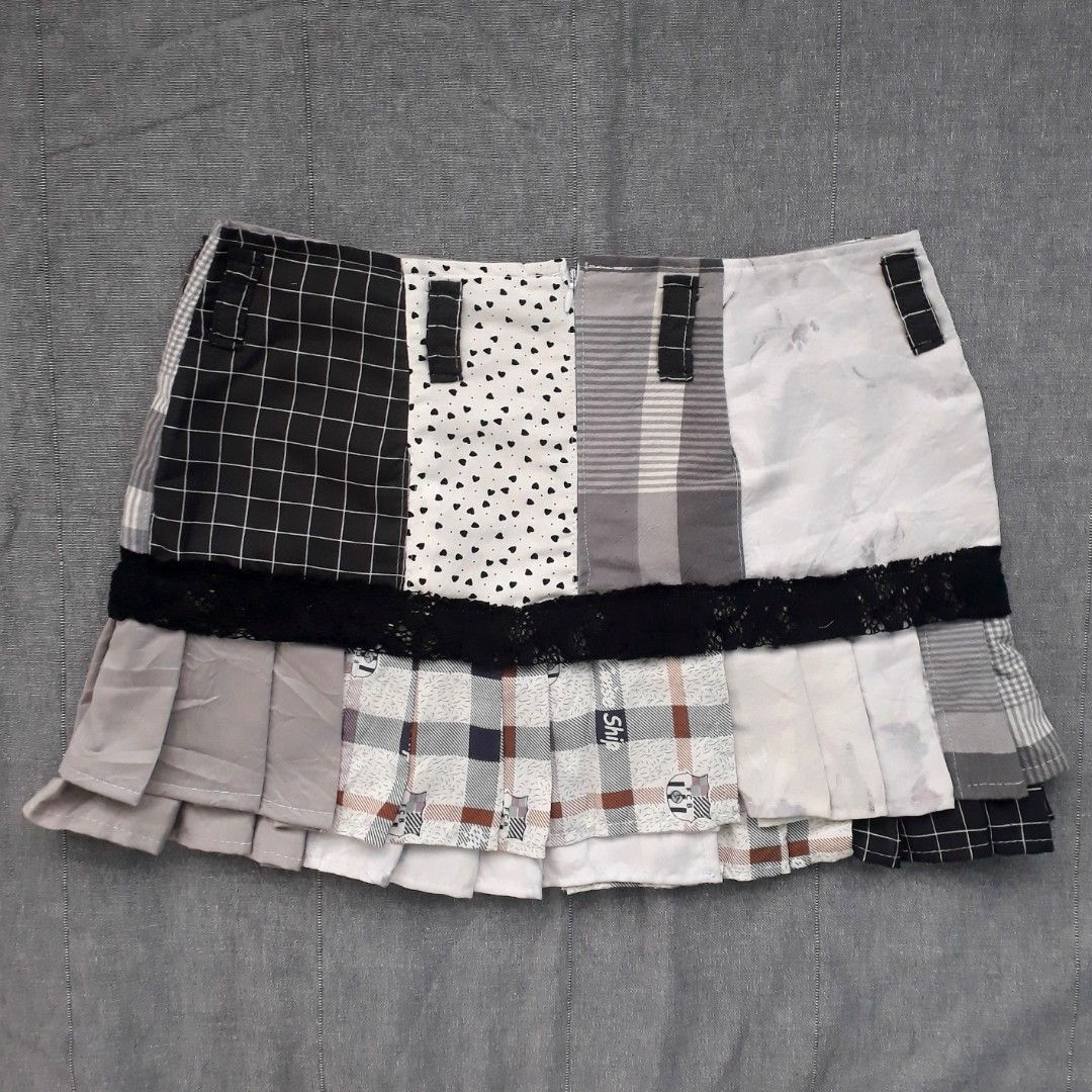 Monochrome Patchwork Pleated Mini Skirt (Category: Skirts) located in Cabanatuan. Submitted by madeby_csnstudio (Listing ID 1468730393, Image 3). Description: MEASUREMENTS: Waist: 30 inches (76.2 cm) Hips: 37 inches (93.98 cm) Length: 13 inches (33.02 cm) DETAILS: The panels feature a stylish blend of mini heart prints, crisp grid checks, subtle floral graphics, and classic plaid patterns. Built-in belt loops accent the waist with matching patchw