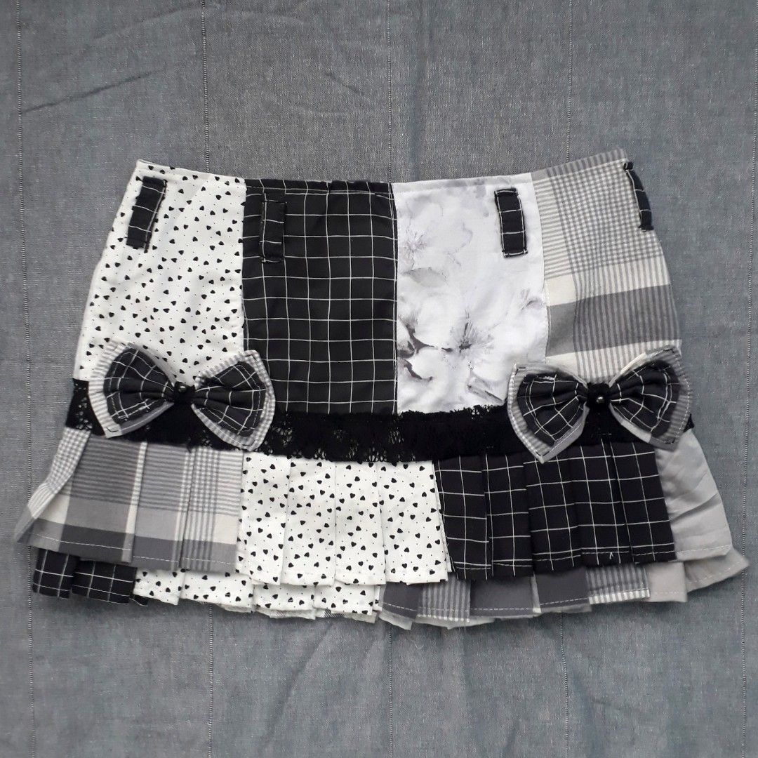 Monochrome Patchwork Pleated Mini Skirt (Category: Skirts) located in Cabanatuan. Submitted by madeby_csnstudio (Listing ID 1468730393, Image 2). Description: MEASUREMENTS: Waist: 30 inches (76.2 cm) Hips: 37 inches (93.98 cm) Length: 13 inches (33.02 cm) DETAILS: The panels feature a stylish blend of mini heart prints, crisp grid checks, subtle floral graphics, and classic plaid patterns. Built-in belt loops accent the waist with matching patchw