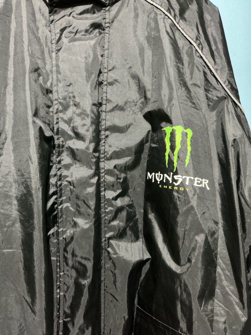 Monster Energy 2000s Reflective Rain Jacket (Category: Coats, Jackets and Outerwear) located in Bulacan. Submitted by garmentsbyadi. (Listing ID 1468782759, Image 2). Description: ⚡ MONSTER ENERGY 2000s REFLECTIVE RAIN JACKET ⚡ 🖤 Y2K Vintage Streetwear | Reflective Design Bring back the 2000s with this Monster Energy reflective rain jacket! Perfect for vintage streetwear lovers, Y2K fits, and bold street-style looks. 🏁 ✨ Details: * Brand/Design
