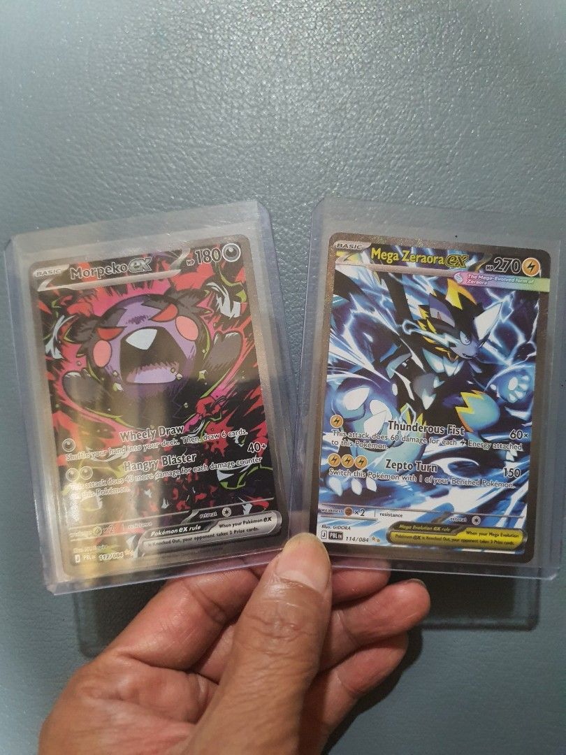 Morpeko ex and Mega Zeraora ex (Category: Raw Singles) located in Taguig. Submitted by biliako (Listing ID 1468833572, Image 2). Description: Morpeko ex and Mega Zeraora ex from pokemon pitch black series. Selling as lot. RFS >>> already have 2 of each..