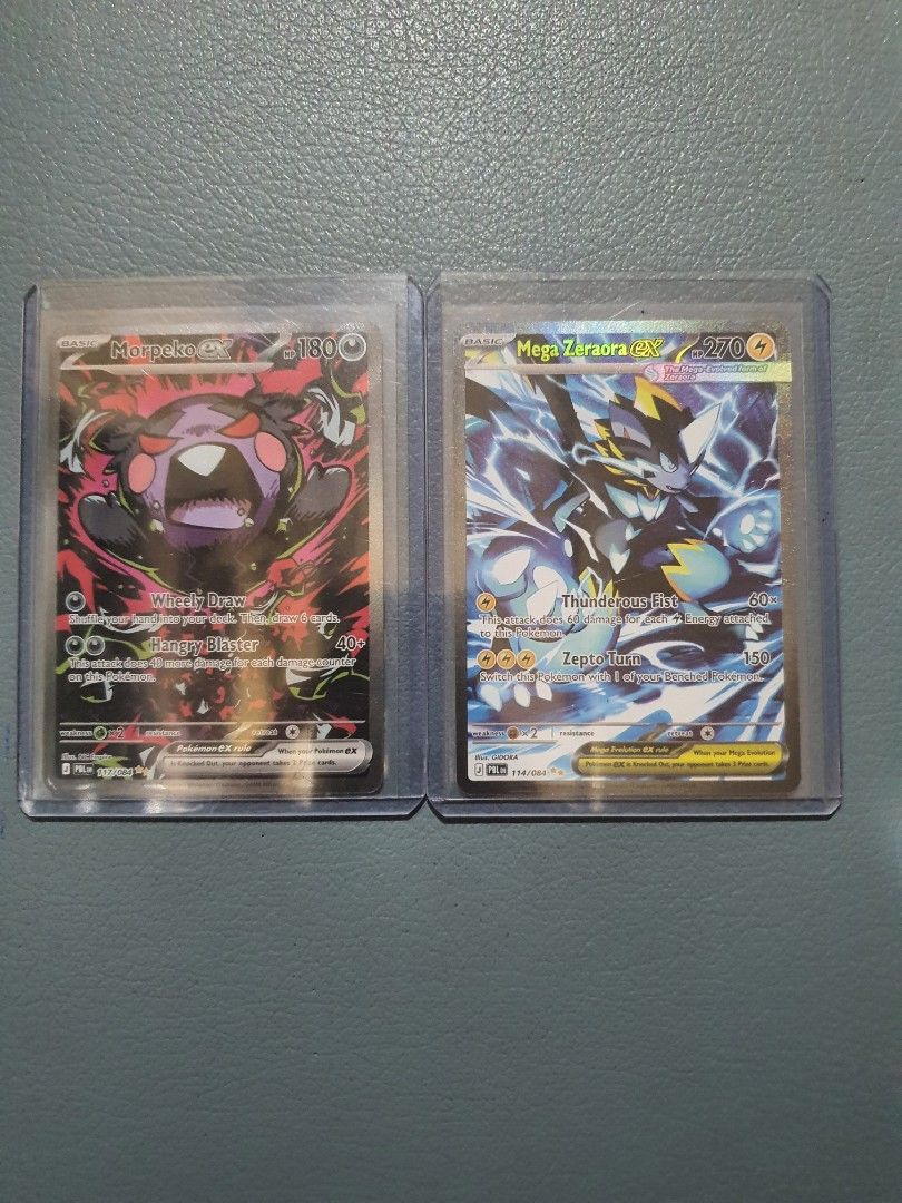 Morpeko ex and Mega Zeraora ex (Category: Raw Singles) located in Taguig. Submitted by biliako (Listing ID 1468833572, Image 1). Description: Morpeko ex and Mega Zeraora ex from pokemon pitch black series. Selling as lot. RFS >>> already have 2 of each..