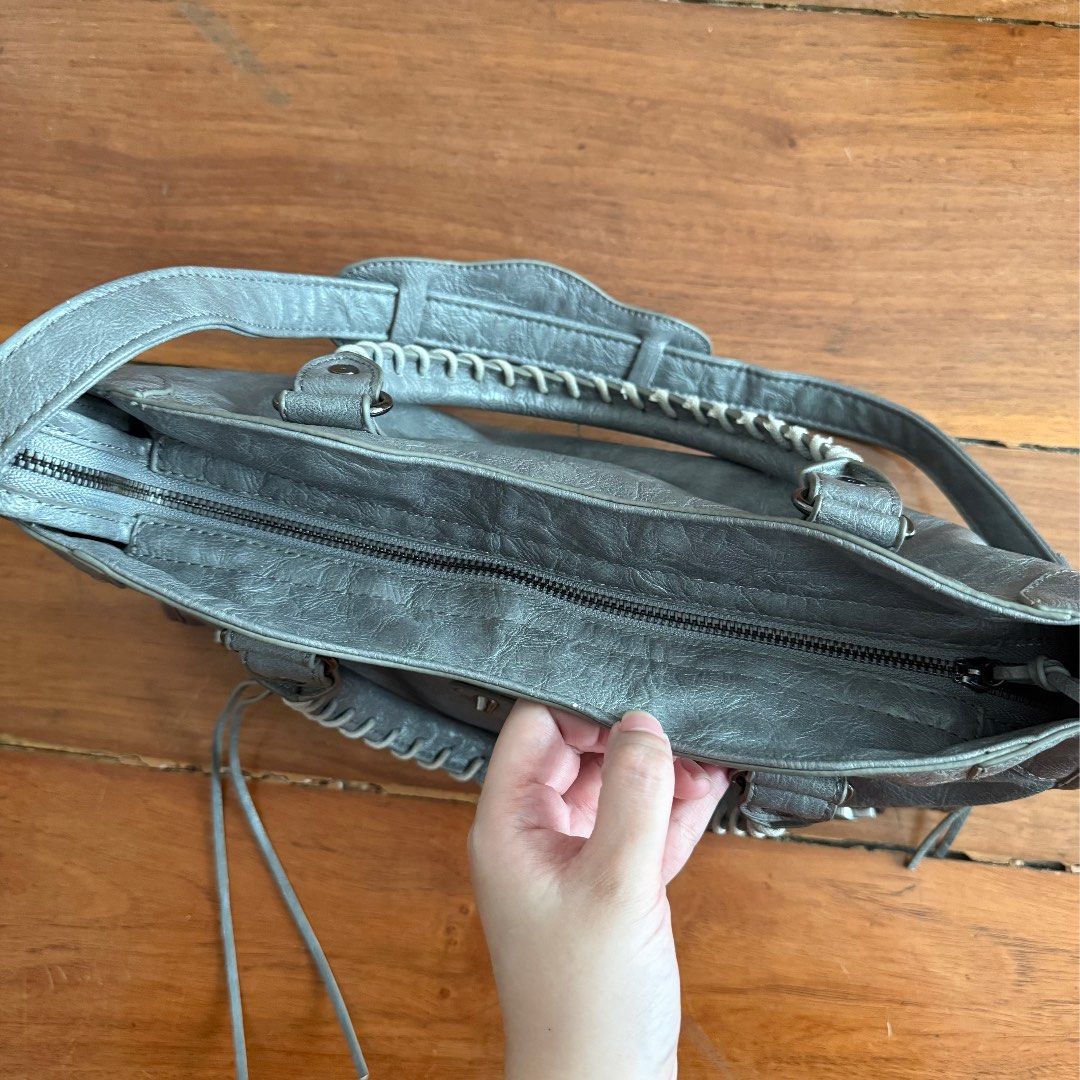 Motorcycle Bag (Category: Shoulder Bags) located in Rizal. Submitted by rocellle (Listing ID 1468736129, Image 2). Description: gray studded motorcycle balenciaga insp city bag · w15”, H14” · exquisite condition, no major flaws (only slight rubs on corners) but still great imo! · best condition, beautiful color · can fit ipad, comes with sling · so beautiful!.