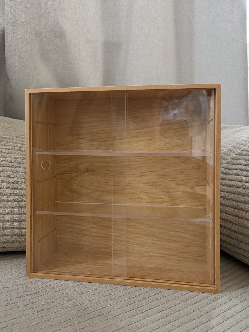 MUJI Wooden Collection Stand with Pull Door (Category: Shelves, Cabinets & Racks) located in Mandaluyong City. Submitted by mockinqjay (Listing ID 1468781035, Image 2). Description: - Authentic MUJI wooden collection stand - Features clear, scratch-free transparent sliding doors - Compact size: roughly 10.9 x 3.3 x 10.9 inches - Removable shelves for customizable spacing - Ideal for miniature figures, small collectibles, and trinkets (Smiskis, So