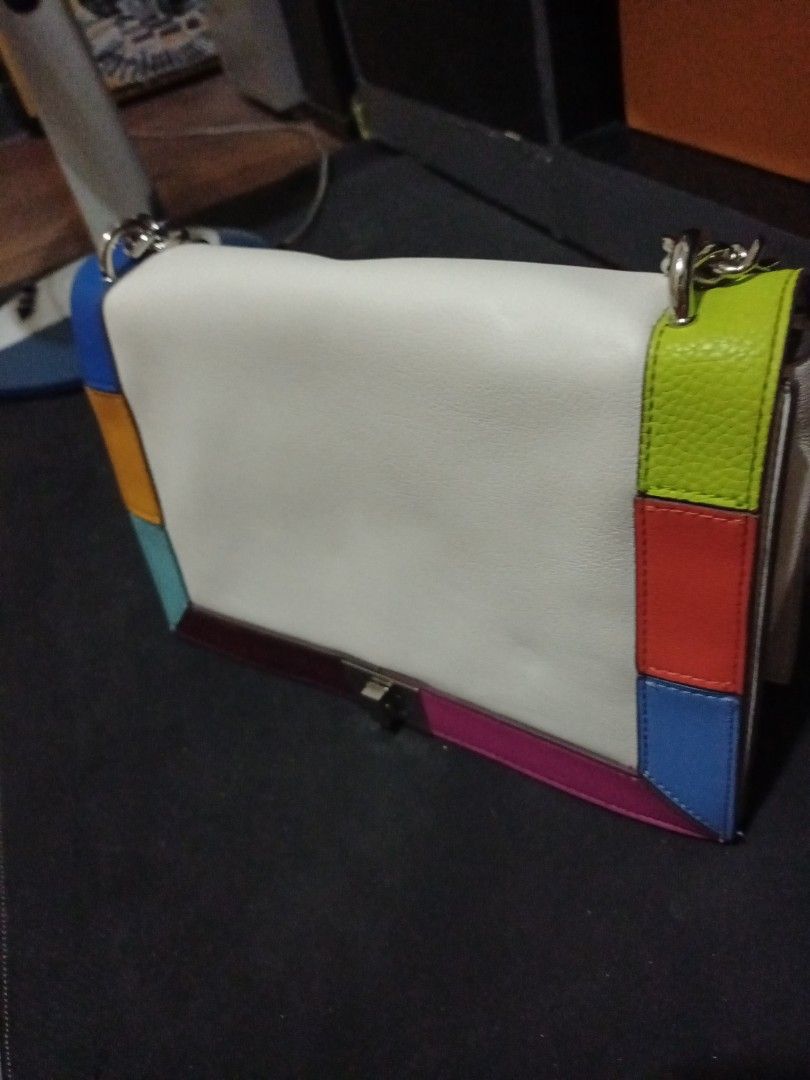 Multicolor Patchwork Shoulder Bag with Chain Strap (Category: Shoulder Bags) located in Manila. Submitted by luckyeagle-7ff8 (Listing ID 1468875022, Image 2). Description: - Style: White leather shoulder bag with vibrant multicolored patchwork trim (bright blue, orange, lime green, burgundy) - Strap: Trendy chunky silver metal chain mixed with a comfortable leather shoulder section - Closure: Secure front flap with a twist lock mechanism - Struct