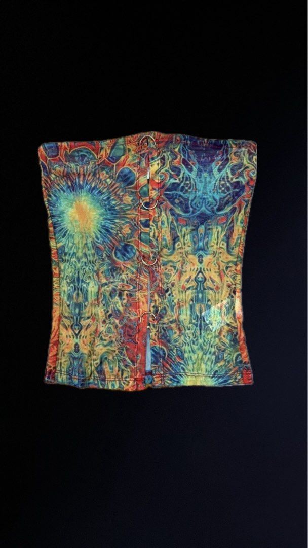 Musera Top (Category: Sleeveless) located in San Juan City. Submitted by Goodstuffhere (Listing ID 1468712512, Image 1). Description: - Style: Strapless tube top with a trendy cropped length - Design: Eye-catching abstract psychedelic print in blue, yellow, orange, and red - Details: Front opening secured with four chic metal O-rings - Material: Lightweight, breathable mesh fabric - Condition: Brand new / Excellent - Shipping: Ships locally via J