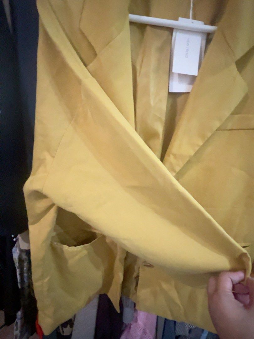 Mustard Yellow Oversized Casual Blazer Size L (Category: Coats, Jackets and Outerwear) located in Quezon City. Submitted by kishey (Listing ID 1468777779, Image 3). Description: - Color: Mustard yellow - Bust: 46 inches - Length: 27 inches - Details: Structured lapels, two front button closures, functional flap pockets - Condition: Brand new with original tag attached - Interior: Fully lined.