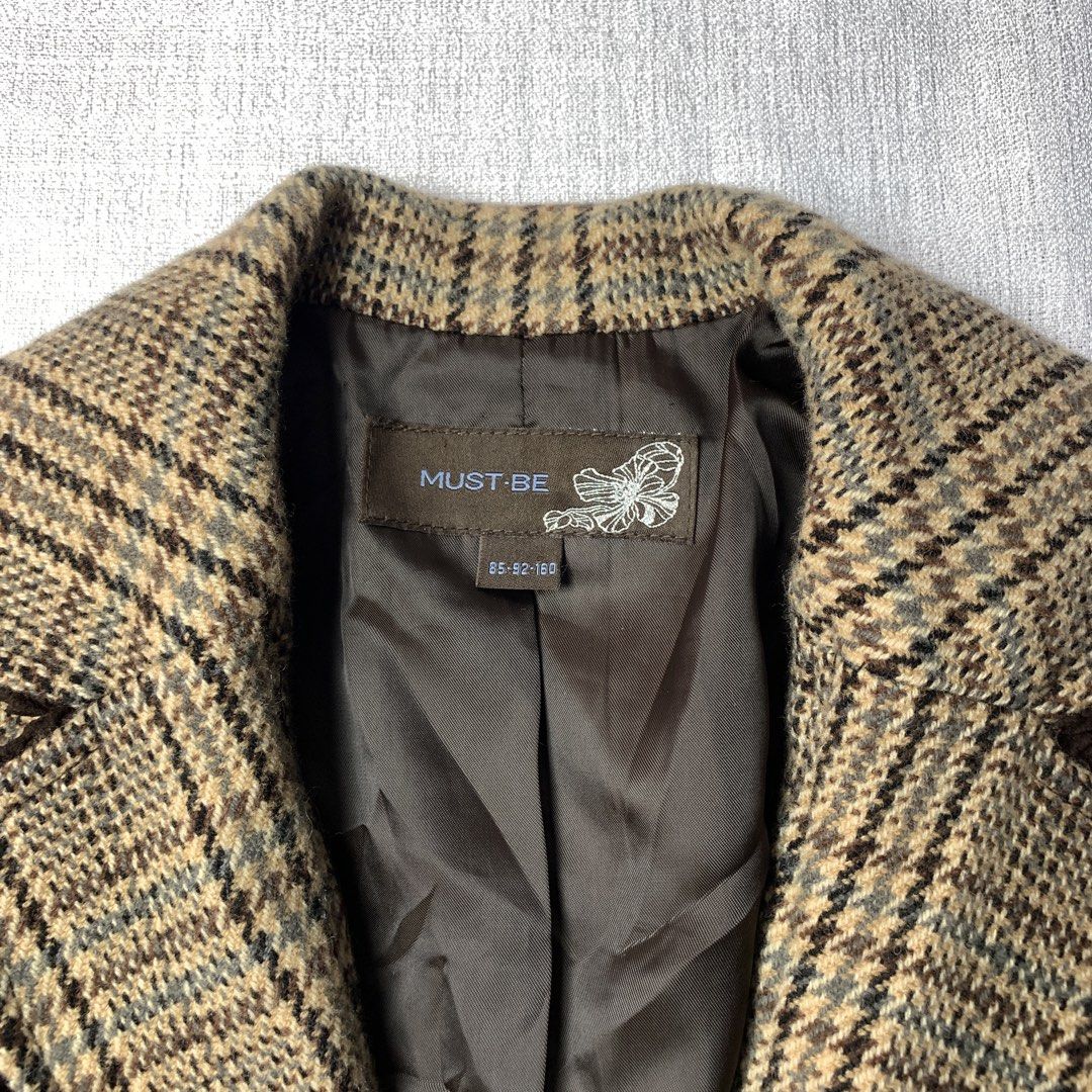MUST-BE Brown Plaid Peplum Blazer Jacket (Category: Coats, Jackets and Outerwear) located in Rizal. Submitted by shop_ms.lai (Listing ID 1468772430, Image 2). Description: - Brand: Must-Be - Size: 85-92-160 - Design: Brown plaid with structured fit and flattering flared peplum hem - Details: Contrast brown trim on collar and lapels, two dark brown front buttons - Interior: Fully lined with dark brown fabric - Condition: Excellent pre-loved condit