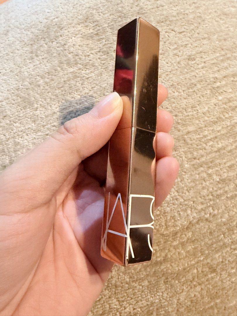 NARS Afterglow Sensual Shine Lipstick in Devotion (Category: Makeup) located in Taguig. Submitted by jennifer_sells (Listing ID 1468800008, Image 1). Description: - Brand: NARS Afterglow Sensual Shine Lipstick - Packaging: Rose gold - Finish: Glossy with high shine and smooth texture - Reason for selling: Shade doesn't match skin tone - Original retail price: ~1,950 PHP Slightly nego only Buyer arrange shipping.