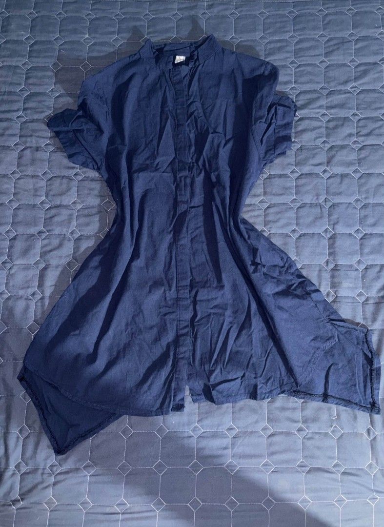 Navy Blue Asymmetrical Hem Short Sleeve Blouse (Category: Blouses) located in Manila. Submitted by itz_zy (Listing ID 1468854126, Image 1). Description: - Color: Dark blue - Material: Lightweight, breathable cotton - Design: Button-up front with a chic mandarin collar - Fit: Relaxed and comfortable through the body - Hemline: High-low asymmetrical cut with pointed side corners - Styling: Great everyday top that pairs easily with jeans or leggings