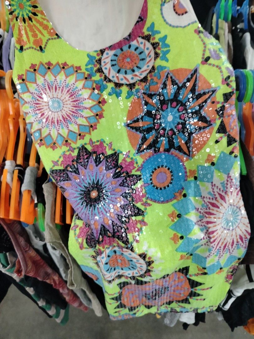 Neon green sequin patterned tank top (Category: Sleeveless) located in Manila. Submitted by virgiliosa38485 (Listing ID 1468719036, Image 2). Description: - Neon green sleeveless top with vibrant mandala and geometric prints - Covered in sparkling sequins along the front design - Plain white fabric on the back - Scoop neckline with a comfortable, relaxed fit - Ideal for parties, music festivals, or casual summer days - Easy to style with your fav