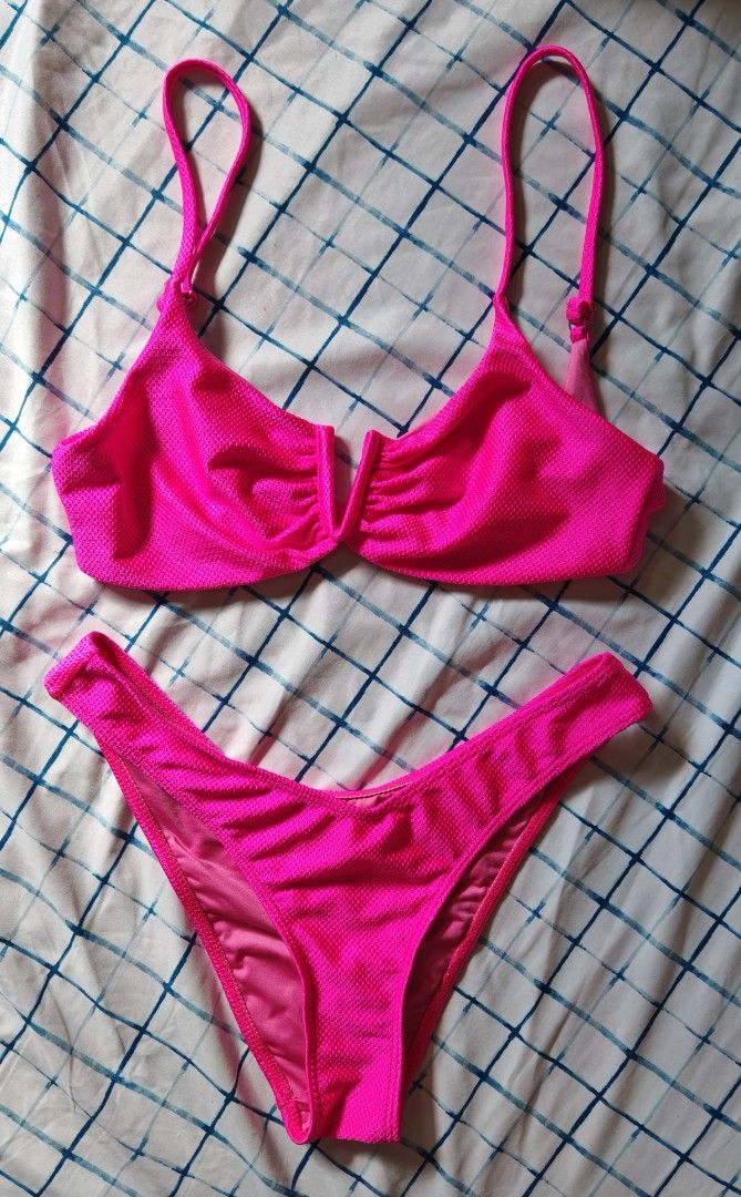 Neon Pink Textured Bikini Set (Category: Bikinis & Swimsuits) located in Paranaque City. Submitted by MLandCobyApple (Listing ID 1468758700, Image 1). Description: - Color: Bright hot pink - Material: Textured waffle-knit fabric with smooth inner lining - Top: Split center design, adjustable straps, clasp back - Bottoms: High-cut leg fit - Ideal for: Beach days, pool parties, and vacations.