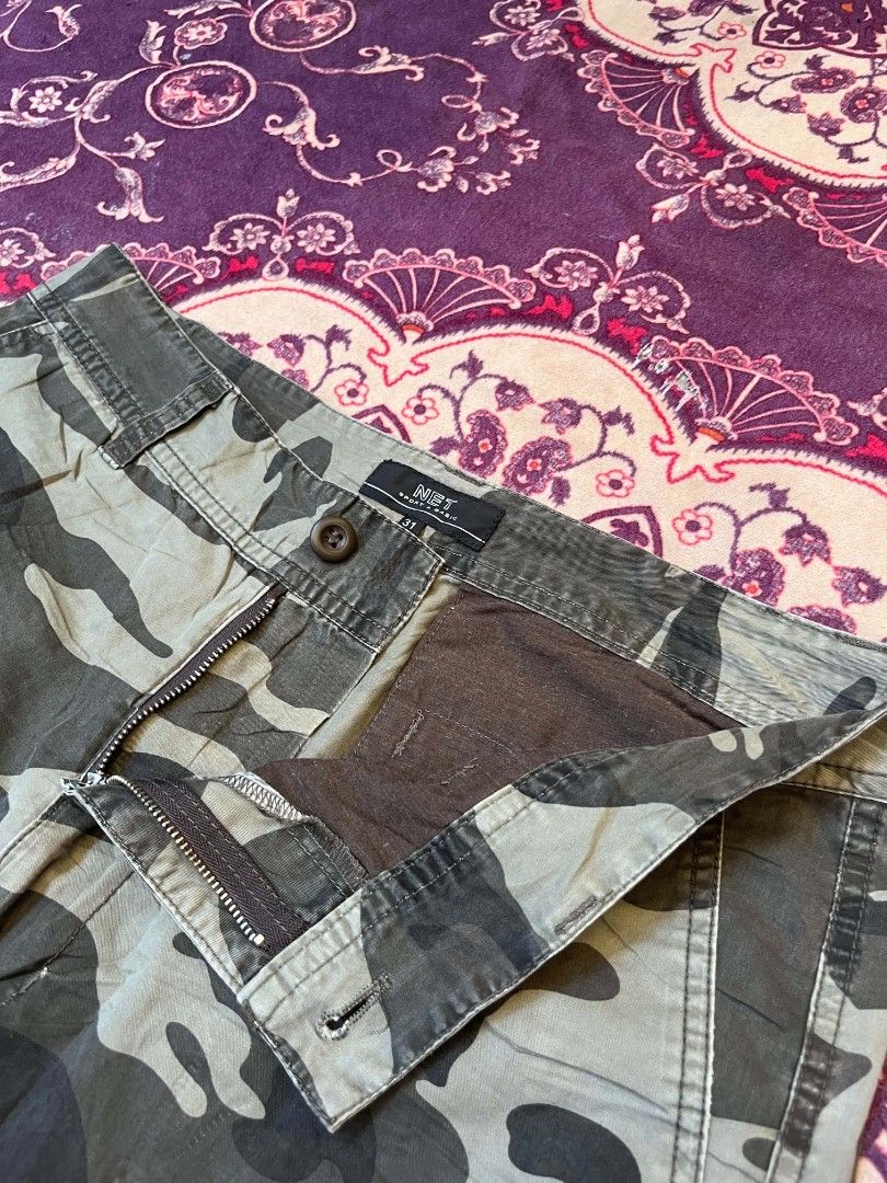 NET Sport & Basic Camouflage Cargo Shorts Size 31 (Category: Shorts) located in Manila. Submitted by safelion-a2982f (Listing ID 1468876767, Image 3). Description: NET Sport & Basic camo cargo shorts in size 31. Earthy green, brown, and grey camouflage pattern. Lots of pocket space with button flaps on the cargo pockets. Zip fly with button closure at the waist. Sturdy cotton fabric, great for outdoor wear or casual daily outfits..