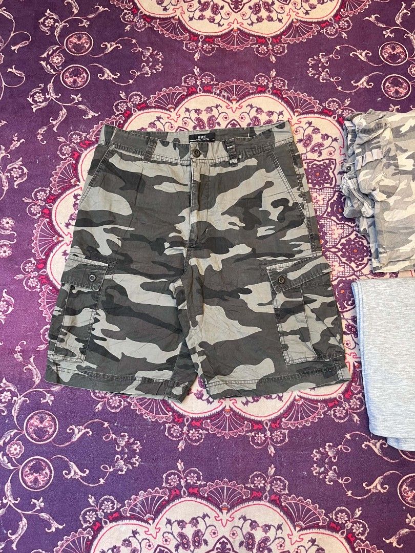 NET Sport & Basic Camouflage Cargo Shorts Size 31 (Category: Shorts) located in Manila. Submitted by safelion-a2982f (Listing ID 1468876767, Image 1). Description: NET Sport & Basic camo cargo shorts in size 31. Earthy green, brown, and grey camouflage pattern. Lots of pocket space with button flaps on the cargo pockets. Zip fly with button closure at the waist. Sturdy cotton fabric, great for outdoor wear or casual daily outfits..