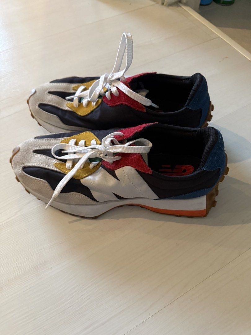 New Balance 327 Multicolour Suede Sneakers (Category: Sneakers) located in Makati City. Submitted by marckyboy (Listing ID 1468747810, Image 2). Description: - Brand: New Balance - Model: 327 Low-Top Trainers - Colorway: Bold mix of black, off-white, yellow, red, and blue - Materials: Premium suede and nylon panels - Design: Oversized white 'N' logo, chunky white midsole, and distinct studded gum rubber outsole - Condition: Clean soles and uppers
