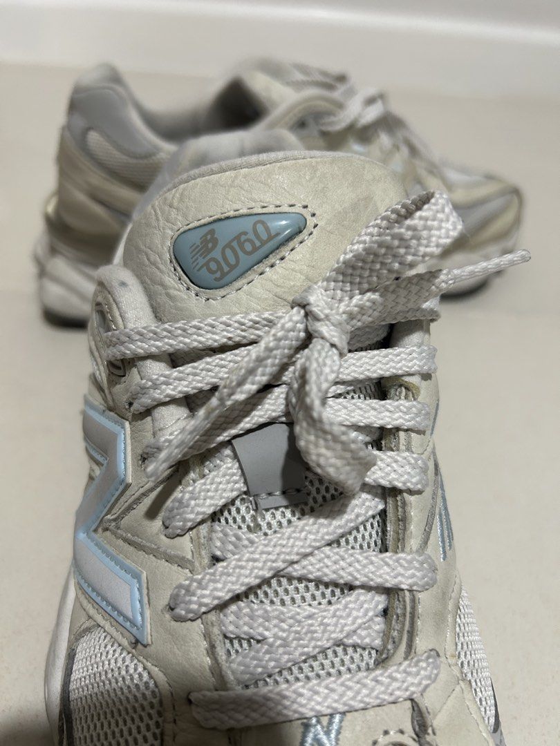 New Balance 9060 white (Category: Sneakers) located in Las Pinas. Submitted by copthesetops (Listing ID 1468803856, Image 3). Description: New Balance 9060 - Reflecting logo (first pic with flash, second with none) Size: 9.5 Mens Issue: Needs cleaning other than that all fine good quality pair .