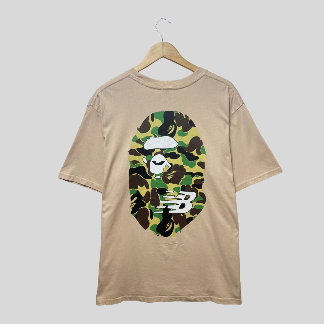 NEW BALANCE x BAPE BIG HEAD TSHIRT (Category: Tshirts & Polo Shirts ) located in La Trinidad. Submitted by suave.arc (Listing ID 1468849225, Image 2). Description: NEW BALANCE x BAPE BIG HEAD TSHIRT EXCELLENT CONDITION SIZE: XL ( 22x29 ) LOCATION: BAGUIO CITY / LA TRINIDAD SHIPPING via JNT.