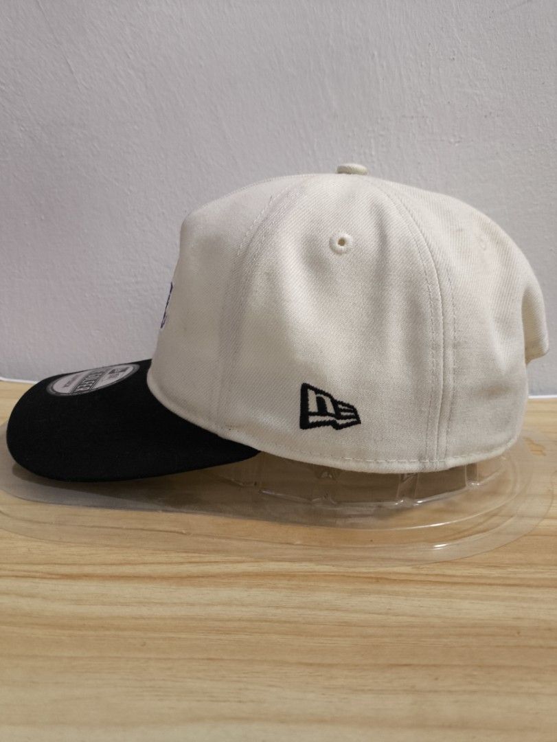 New Era LA Lakers The Golfer Snapback Cap (Category: Caps & Hats) located in San Fernando. Submitted by FronzAllGoods (Listing ID 1468716645, Image 2). Description: - Brand: New Era (The Golfer Series) - Team: LA Lakers - Color: Off-white crown with a black flat brim - Closure: Adjustable plastic snapback - Condition: Used-like new with sticker still attached on the brim.