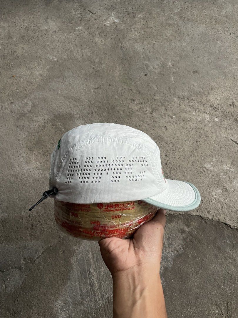 Nice Maco Club All Things Trail Camp Cap White (Category: Caps & Hats) located in Polomolok. Submitted by madagascarts (Listing ID 1468797962, Image 3). Description: - Brand/Model: Nice Maco Club white 5-panel camp cap - Design: 'All Things Trail!' green text with character graphic on the front - Branding: 'Bear Trail Camp' and 'Nice Maco Club' printed in green - Breathability: Perforated side panels for enhanced airflow - Material: Durable and c